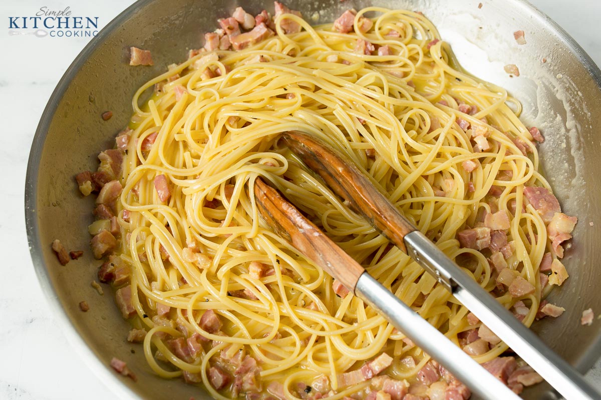 Bowl of Pasta Carbonara in Pan with Tongs